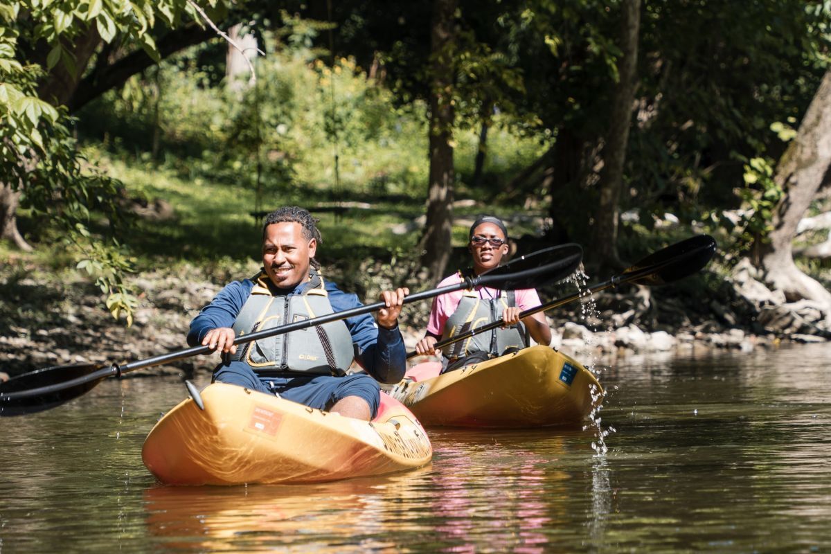 Two kayakers paddling