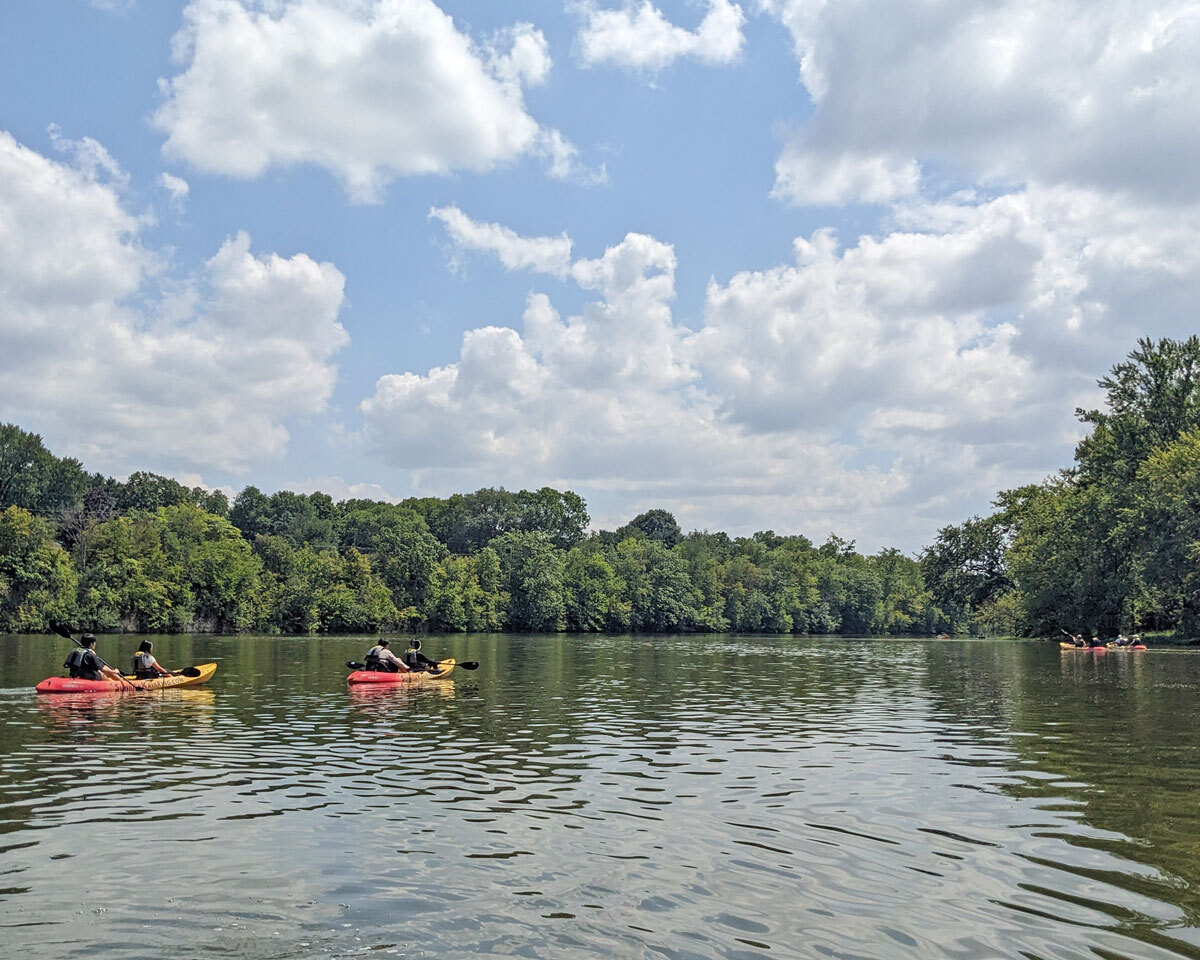 Kayakers paddling down the river